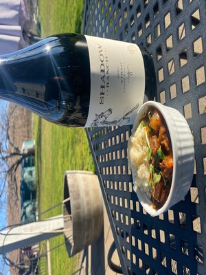 image of beef stew and mashed potatoes in a carafe next to a bottle of Shadow Ranch Syrah